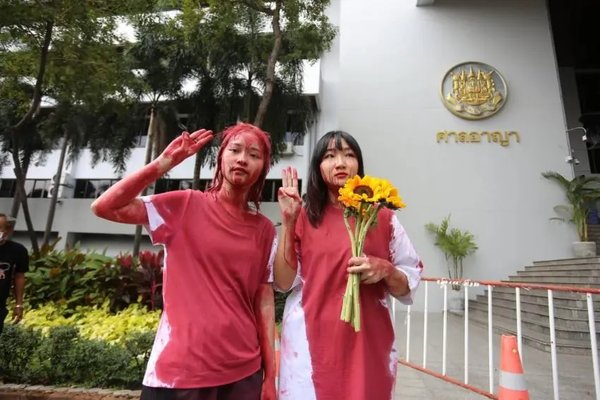 2 Activists protest by pouring red paint on themselves, January 16, 2023 Voice TV
