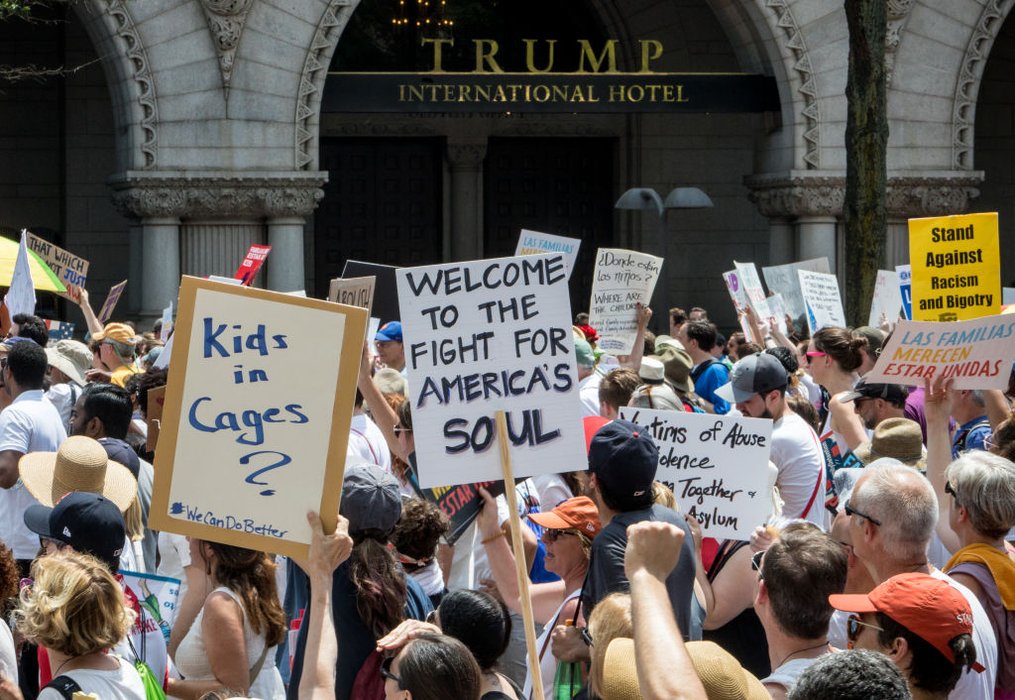 Protestors unfurl 'No ICE, No prisons, No More Cages' banner over