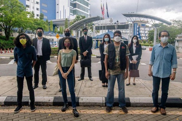 Activists outside Malaysia police headquarters July 2021