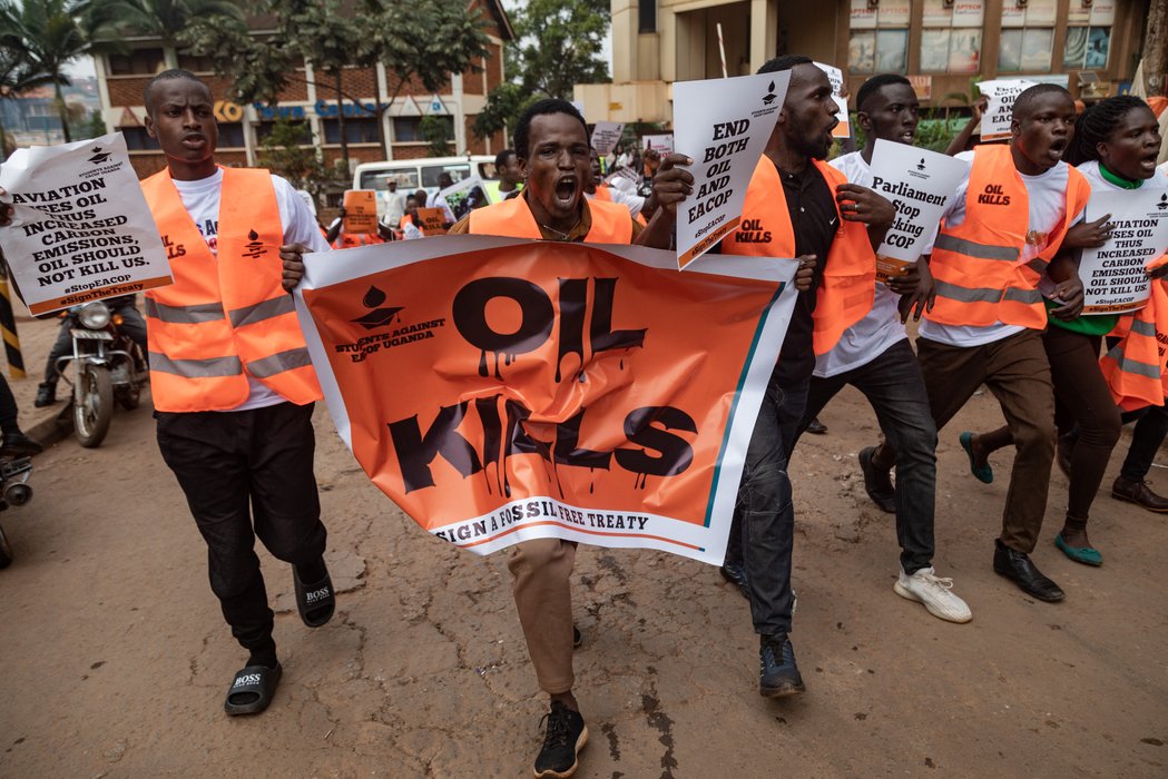 Uganda: Environmental activists hold banners and chant slogans as they protest against the East African Crude Oil Pipeline Project (EACOP) in Kampala.